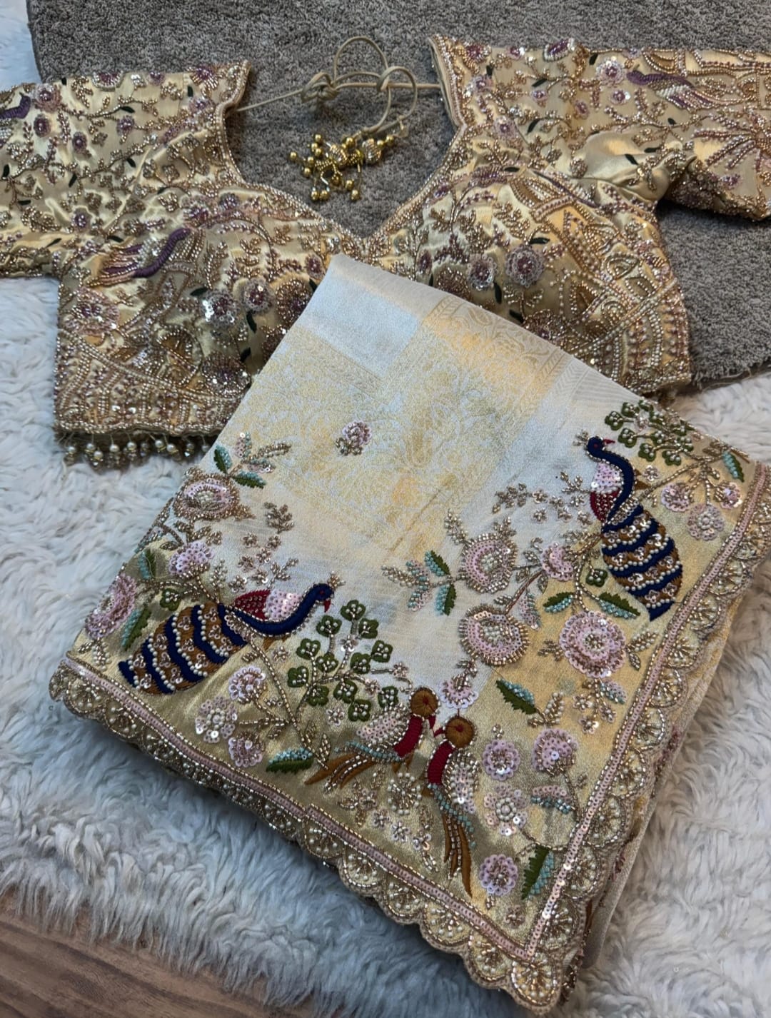 Pastel embroidered peacock saree